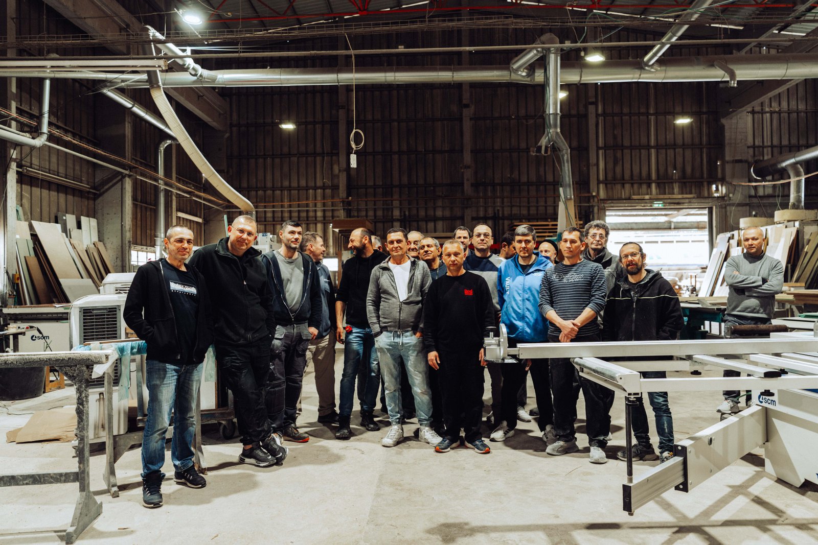 The ArtiArt workshop team standing together in their production facility