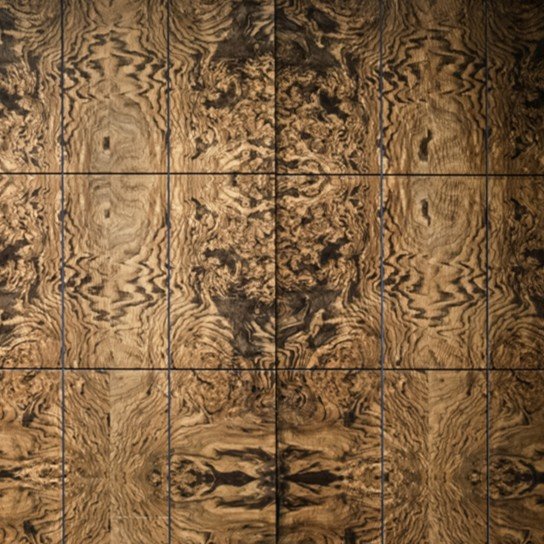 Book-matched olive burl veneer wall in warm browns