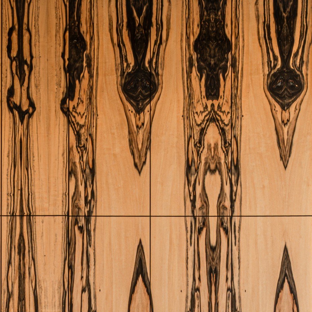 Book-matched white ebony veneer with dramatic black streaking