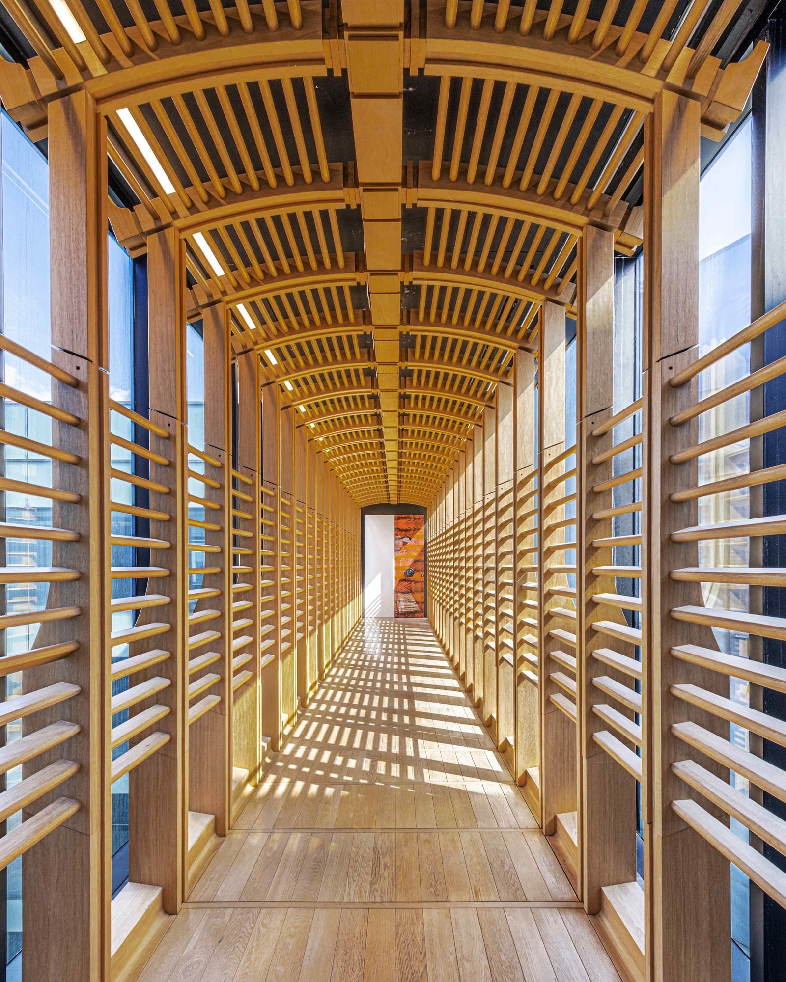 Barrel-vaulted oak lattice corridor